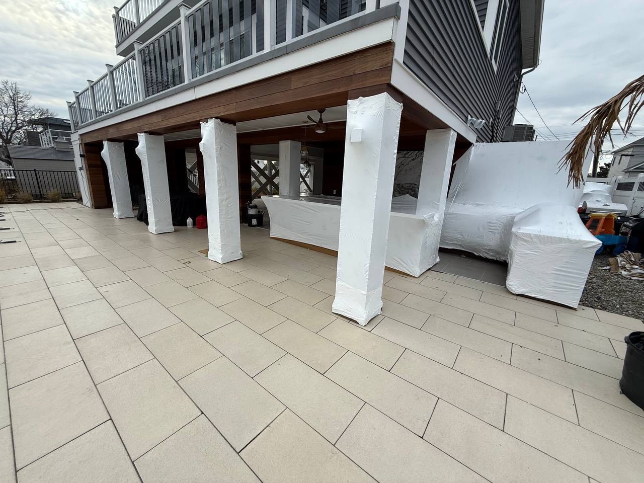 Patio columns and outdoor kitchen shrink wrapped