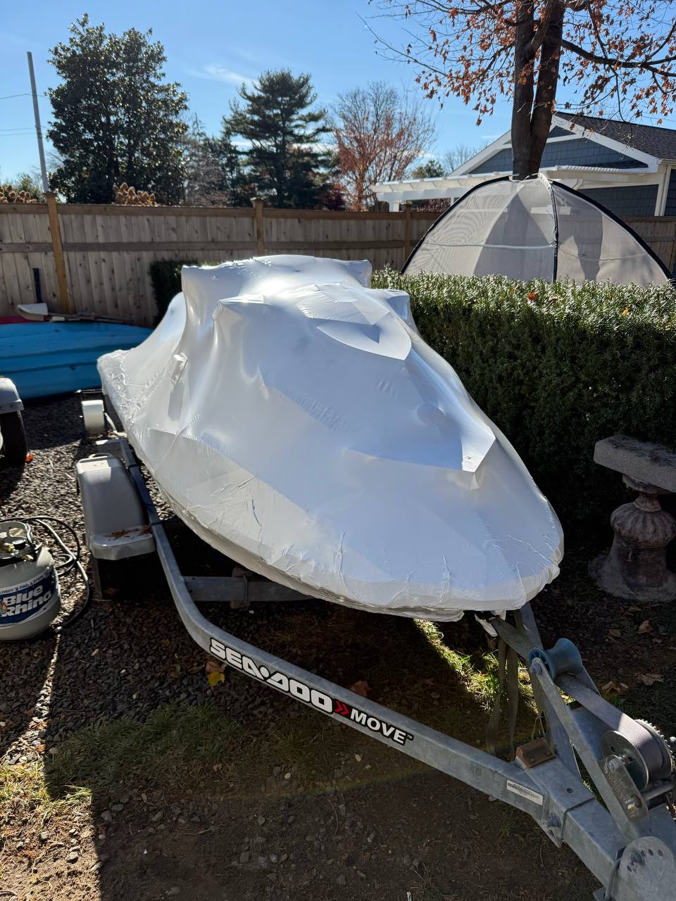 Jet ski shrink wrapped on its trailer