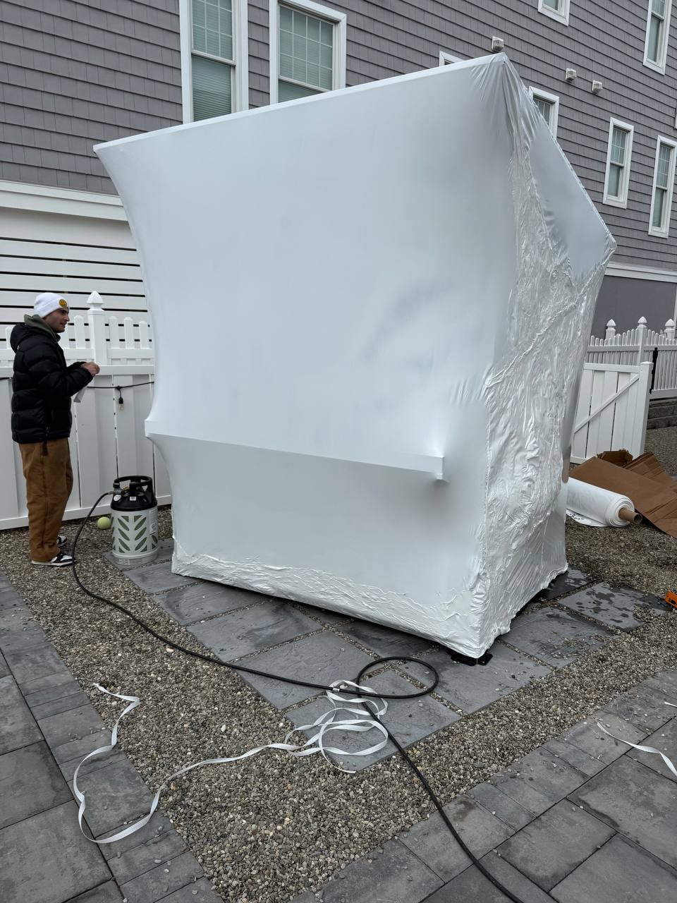 Outdoor bar shrink wrapped with taped seams