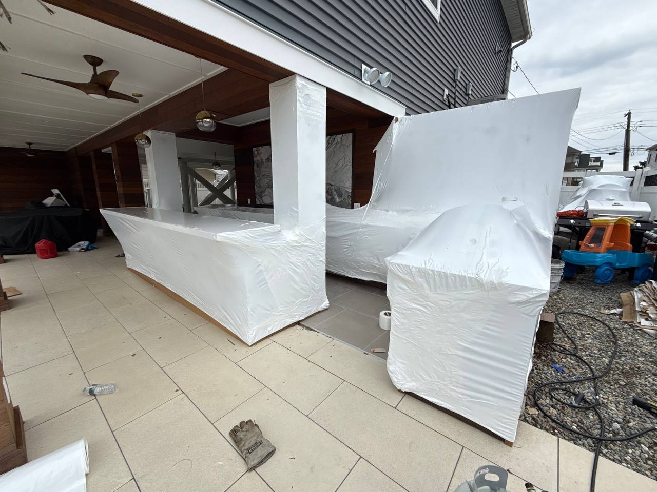Outdoor kitchen and bar shrink wrapped for winter
